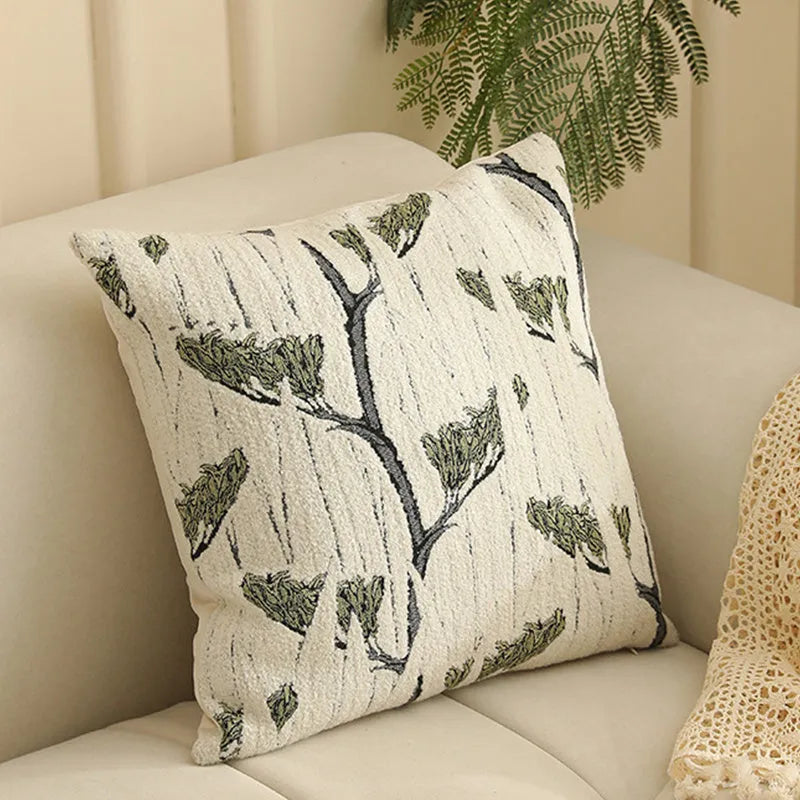 Close-up of a beige and green floral Jacquard woven cushion cover with textured pattern, 45cm square.