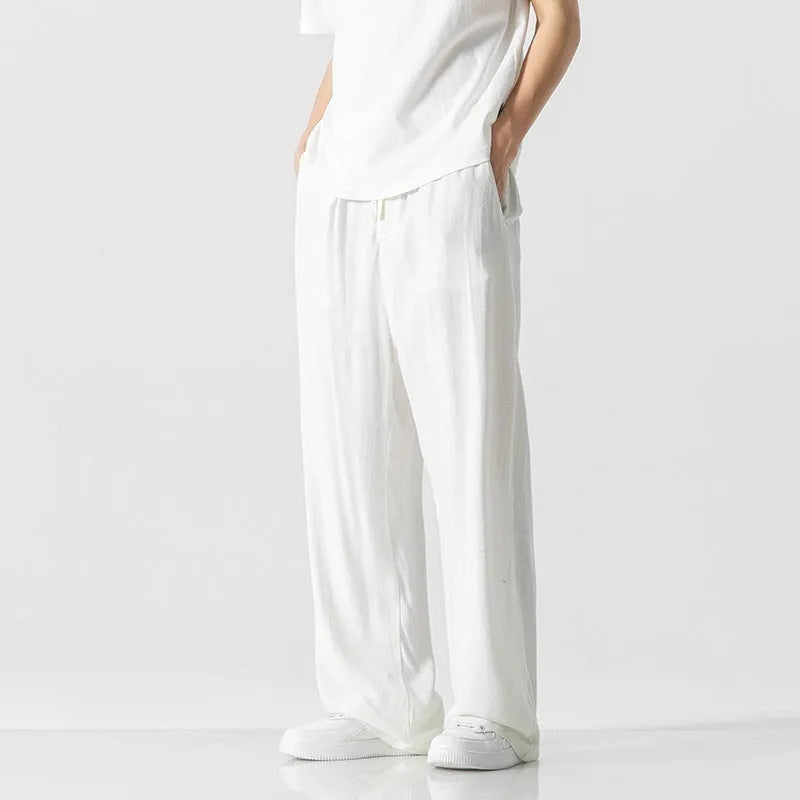 Men's straight-leg casual trousers in beige bamboo fibre fabric with a drawstring waist.