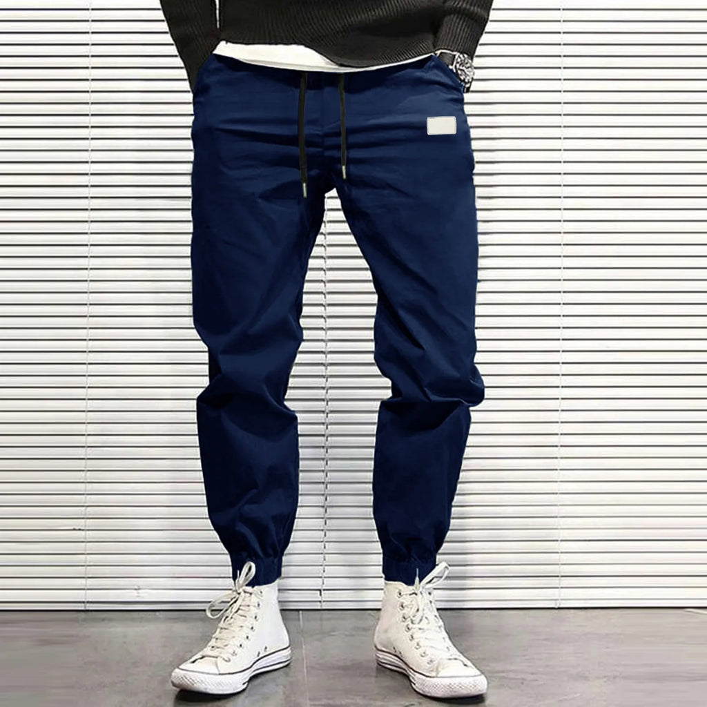 Loose fit quick-dry running trousers in polyester nylon blend, available in four colours and sizes M to XXXL