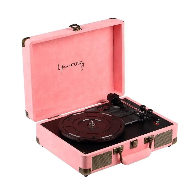 Leather-cased portable Bluetooth turntable for vinyl and film records in multiple colours.
