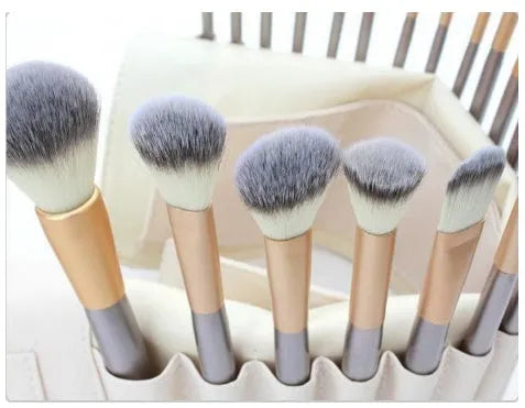 Persian makeup brush set with rice white bristles and champagne colour handles displayed on white background