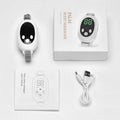 White wireless sleep aid bracelet with handheld remote control on a surface