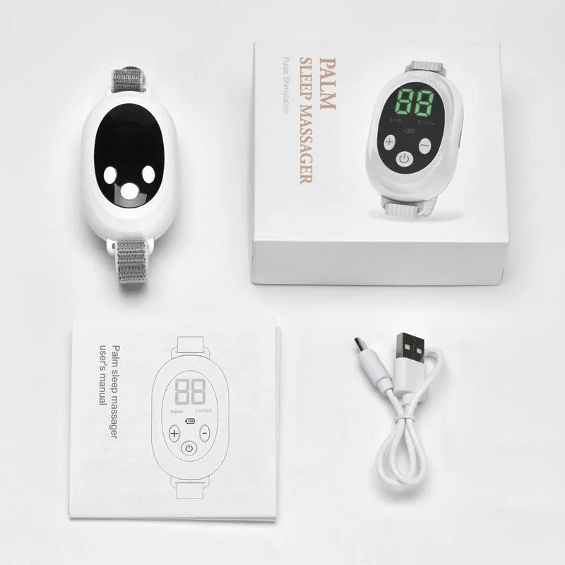White wireless sleep aid bracelet with handheld remote control on a surface