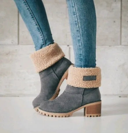 Women's mid-calf suede snow boots in black with a thick low heel and waterproof platform.