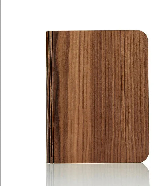Solid wood book light in three sizes with USB cable showing white and warm white light options