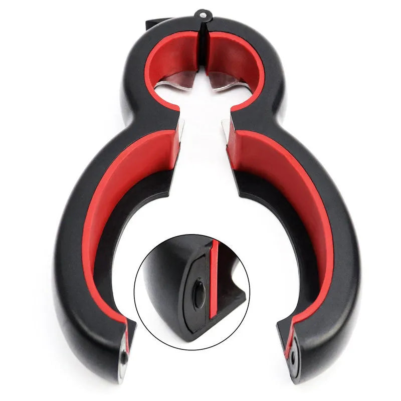 Six-in-one can opener in grey, ergonomic handle with stainless steel parts, on a kitchen counter