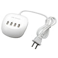 White dual USB wall charger with EU plug style next to smartphone and tablet