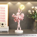 Ballet dancer resin night lamp in pink placed on a hallway table