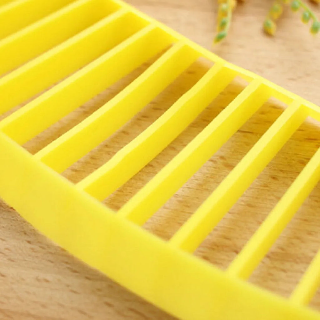 Yellow food grade PP banana slicer measuring approx 25 x 7 x 1.4 cm