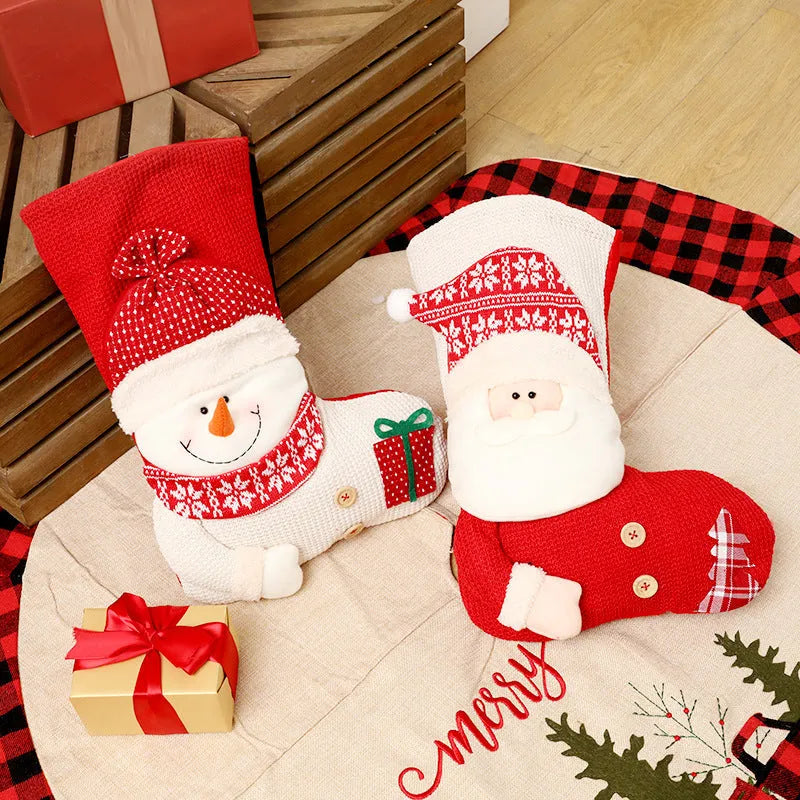 Large red and white knitted Christmas stocking with Santa Claus design for fireplace decor