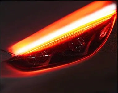 Flexible silicone car LED strip for daytime running lights and animated turn signals on a vehicle headlight.