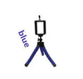 Mini flexible sponge octopus tripod stand holding a smartphone on a desk
