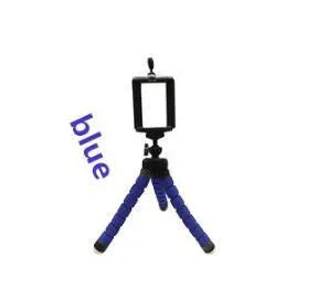 Mini flexible sponge octopus tripod stand holding a smartphone on a desk