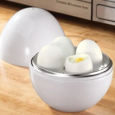 White microwave egg cooker with capacity for 4 eggs on kitchen counter