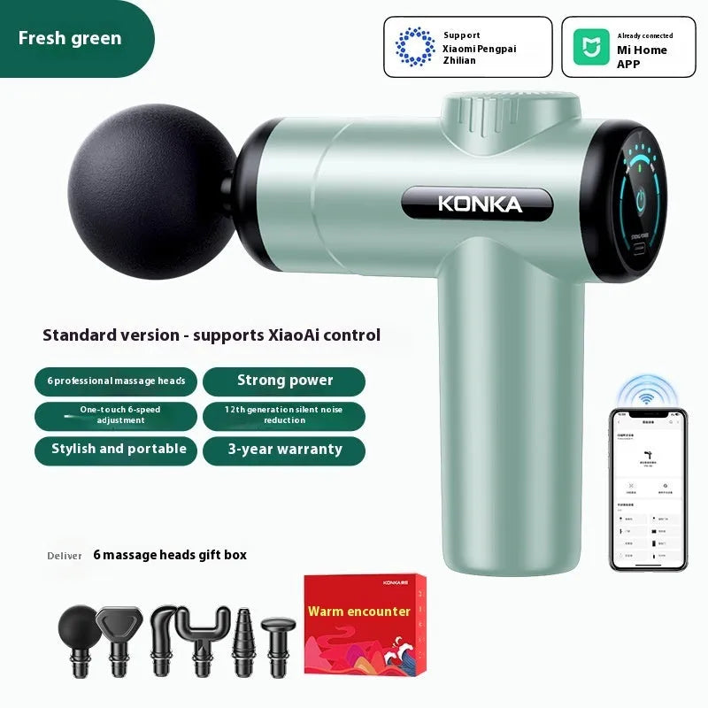 Konka professional electric mini massage gun in grey with multiple massage heads on a table