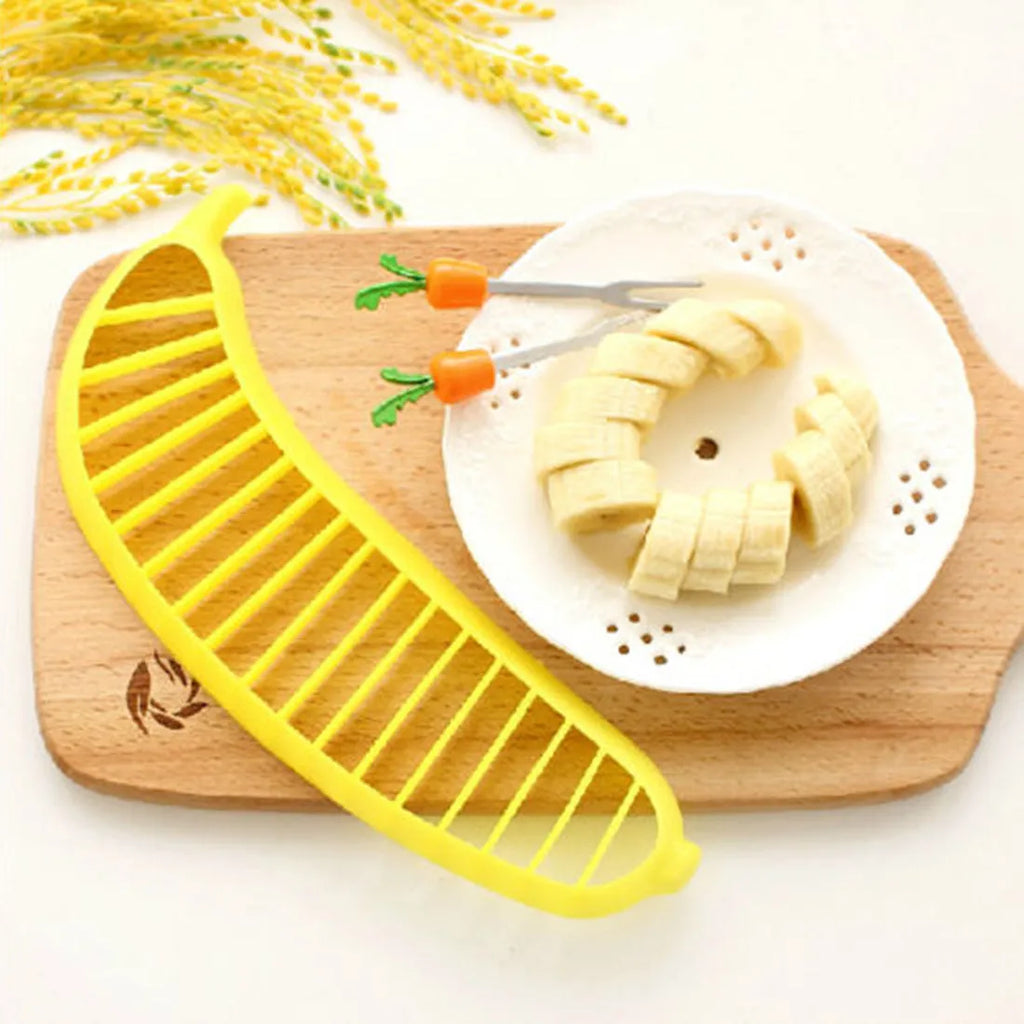 Yellow food grade PP banana slicer measuring approx 25 x 7 x 1.4 cm