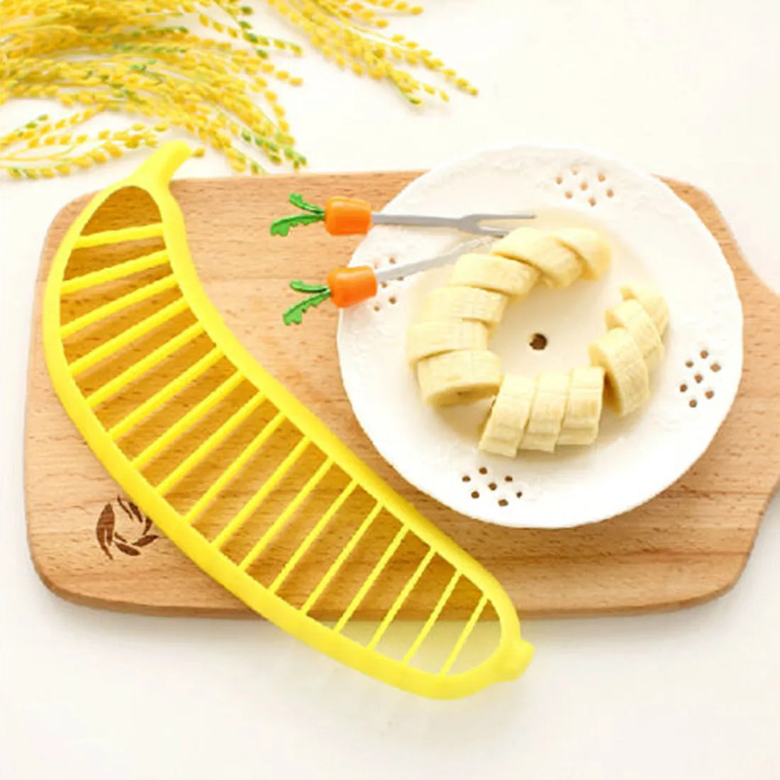 Yellow food grade PP banana slicer measuring approx 25 x 7 x 1.4 cm