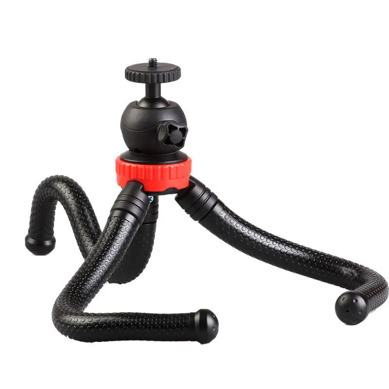 Black octopus tripod with eight flexible rubber legs and a spherical gimbal head for mounting cameras and phones.