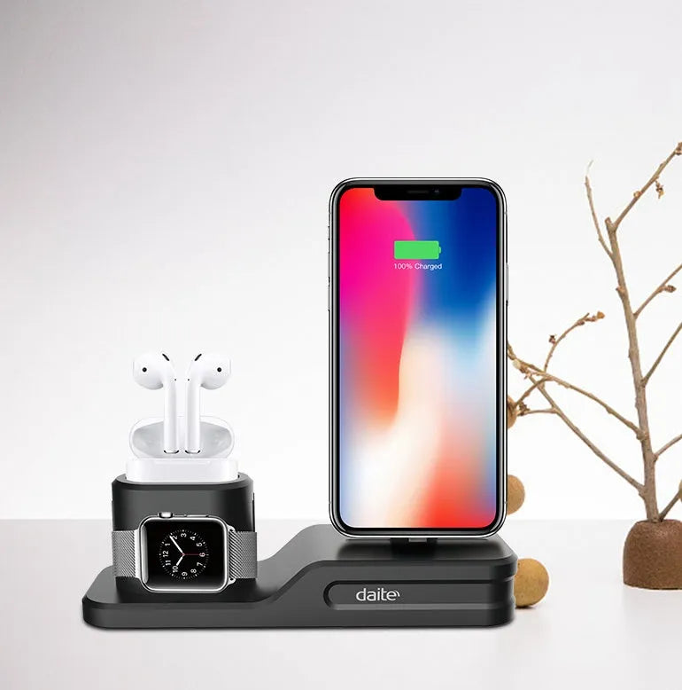 Black silicone 3-in-1 charging station for Apple iPhone, iWatch and AirPods on a desktop