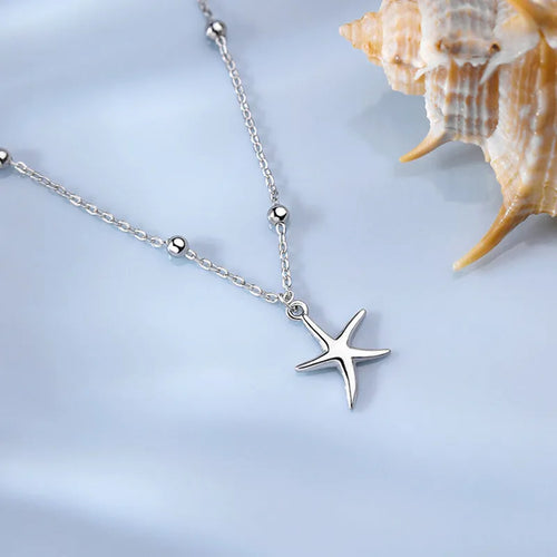 S925 sterling silver anklet with starfish charm and round beads on an adjustable chain.