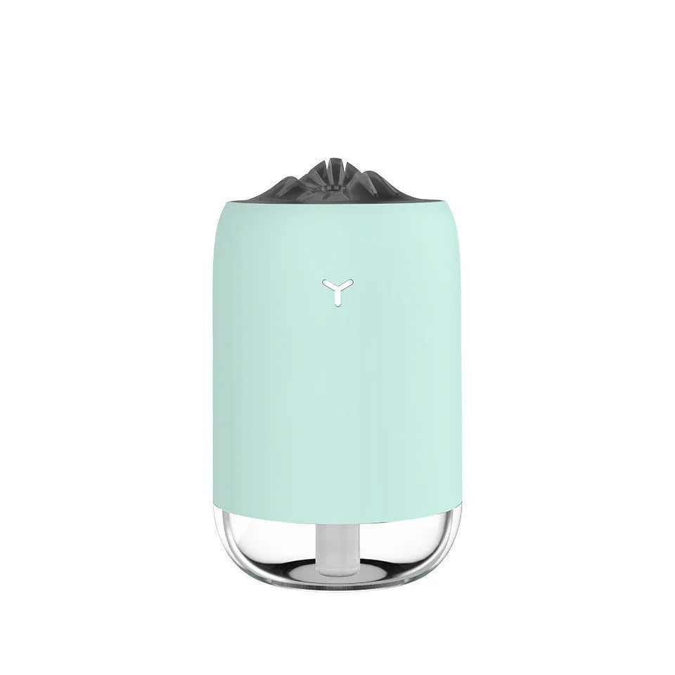 Mini cylindrical USB humidifier in green, pink, or white with 260ml water tank
