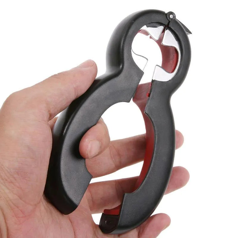 Six-in-one can opener in grey, ergonomic handle with stainless steel parts, on a kitchen counter