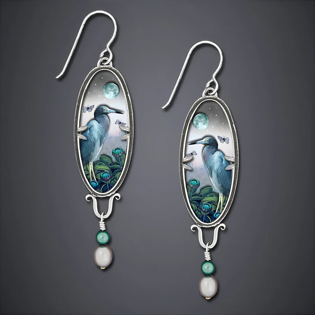 Silver retro-style women's drop earrings with a detailed bird and flower design.
