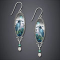 Silver retro-style women's drop earrings with a detailed bird and flower design.