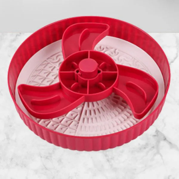Slow feeder dog bowl with rotating game board and textured silicone licking mat insert.