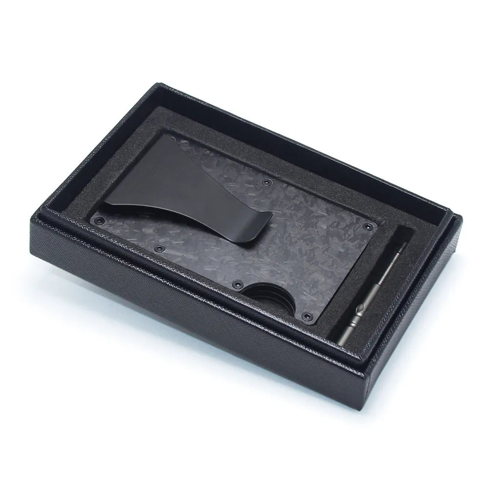 A slim carbon fibre card holder wallet in a geometric design, shown with business cards.