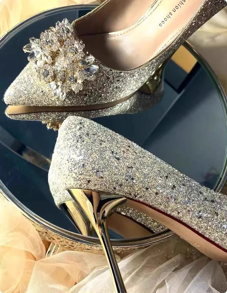Champagne coloured women's wedding shoes with rhinestone flower pattern, pointed toe, and a fine heel.