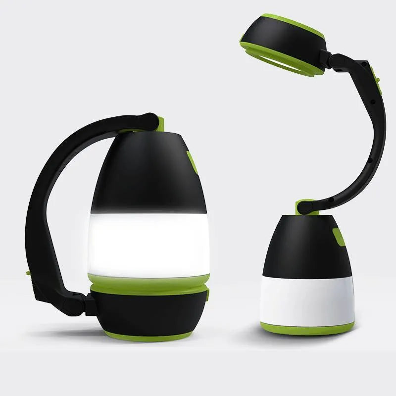 Black green multifunctional LED camping lamp with USB port shown next to a mobile phone.