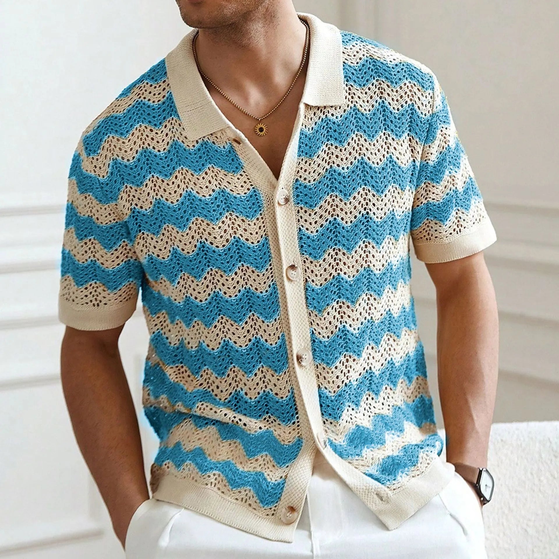 Blue hollow jacquard corrugated short sleeve sweater with flocked detail on a hanger.