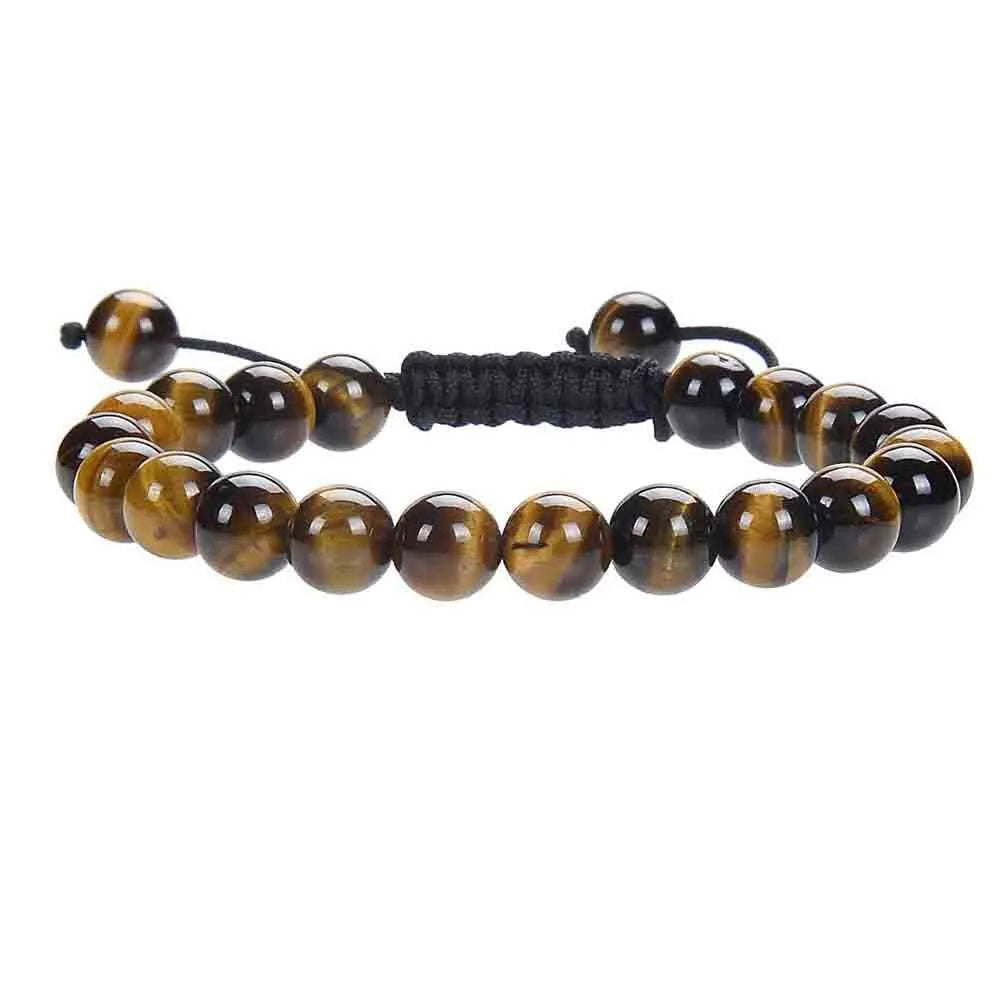 Close-up of a hand-woven flat knot braided bracelet with assorted gemstone beads on a female wrist.