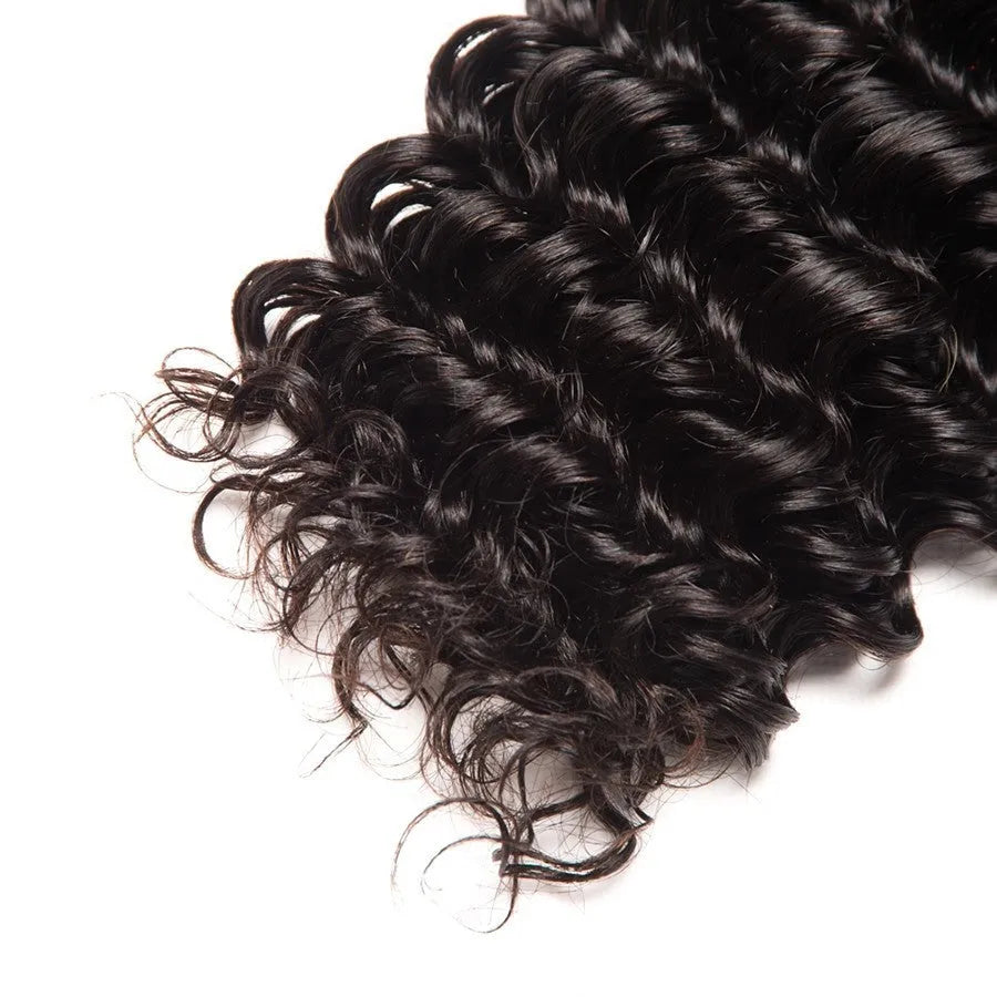 Real hair wig with natural curls in medium long length shown on a mannequin head