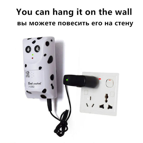 White anti-barking ultrasonic dog repeller mounted on a wall with rotary holder, 7x13x5cm