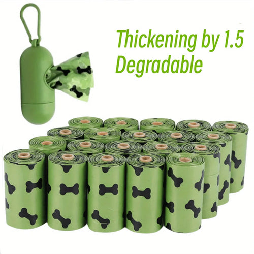 Biodegradable thickened dog poop bags in black and green on a roll with dispenser for pet waste cleanup.