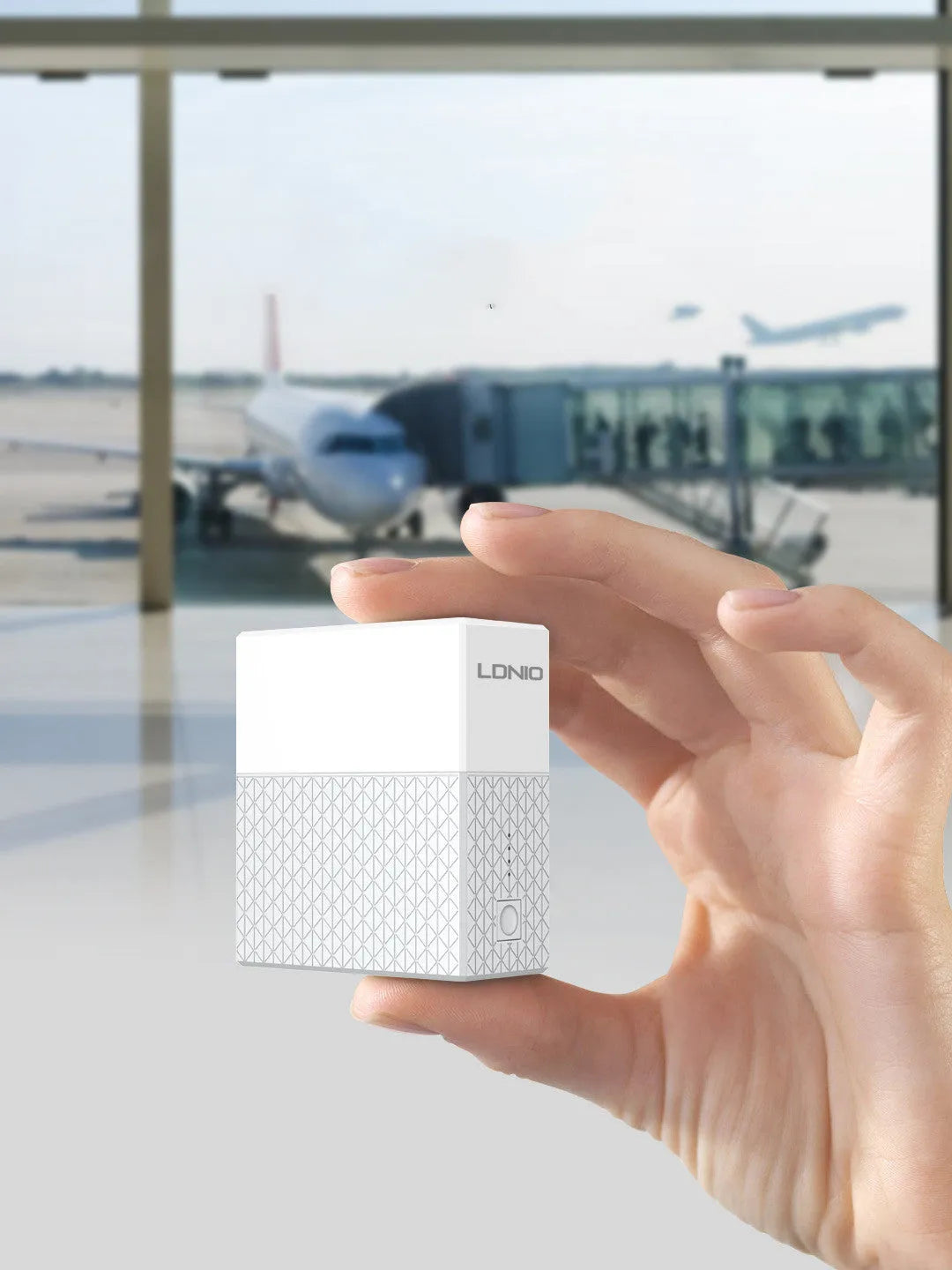 White two-in-one power bank charger with folding plug, showing compact cylindrical design.