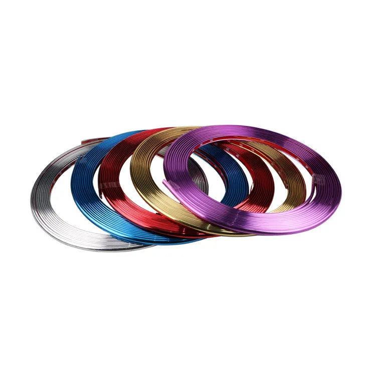 Galvanised purple PVC wheel hub trim protection strip on car alloy wheel