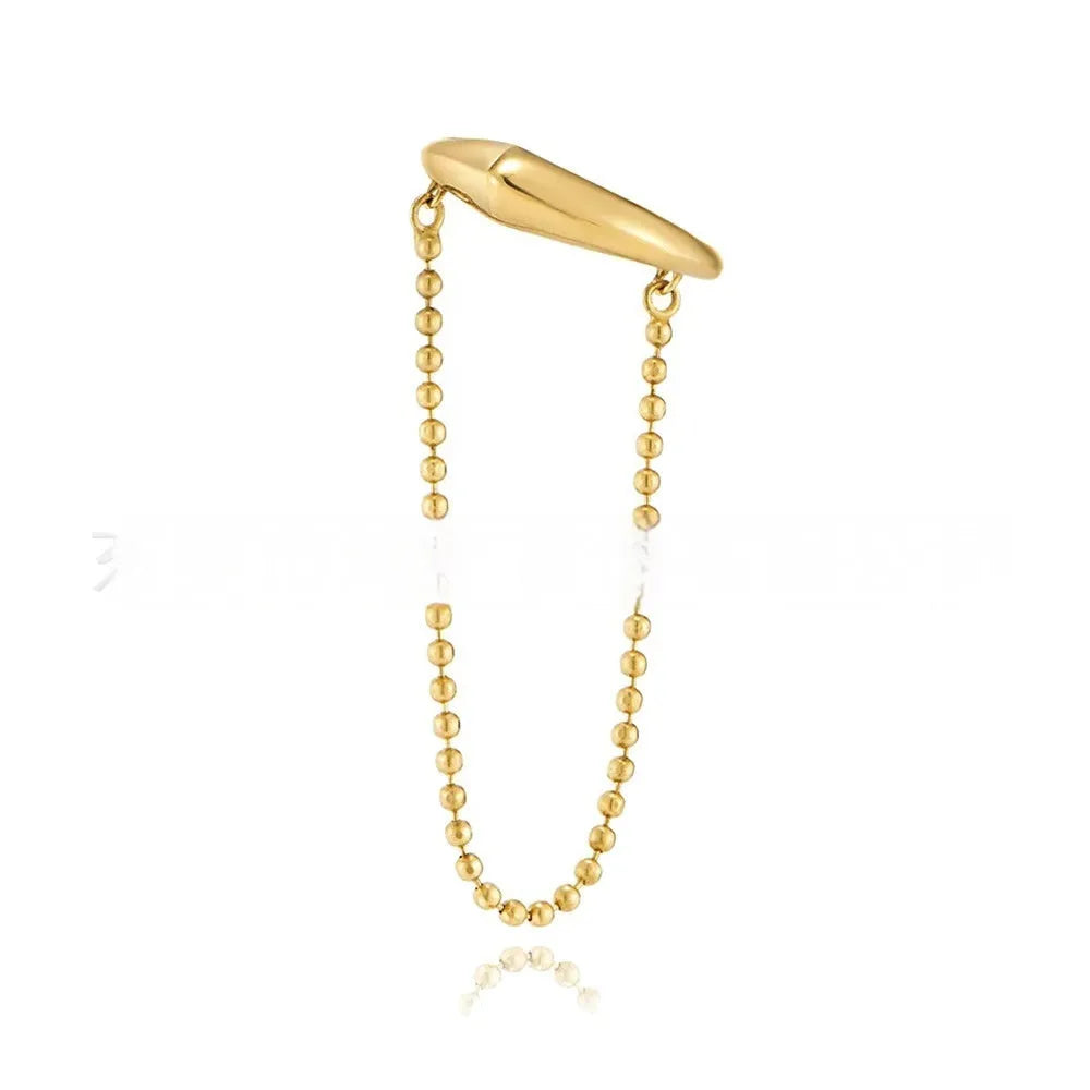 Ball chain tassel ear clip in gold on left ear, copper geometric U-shaped design