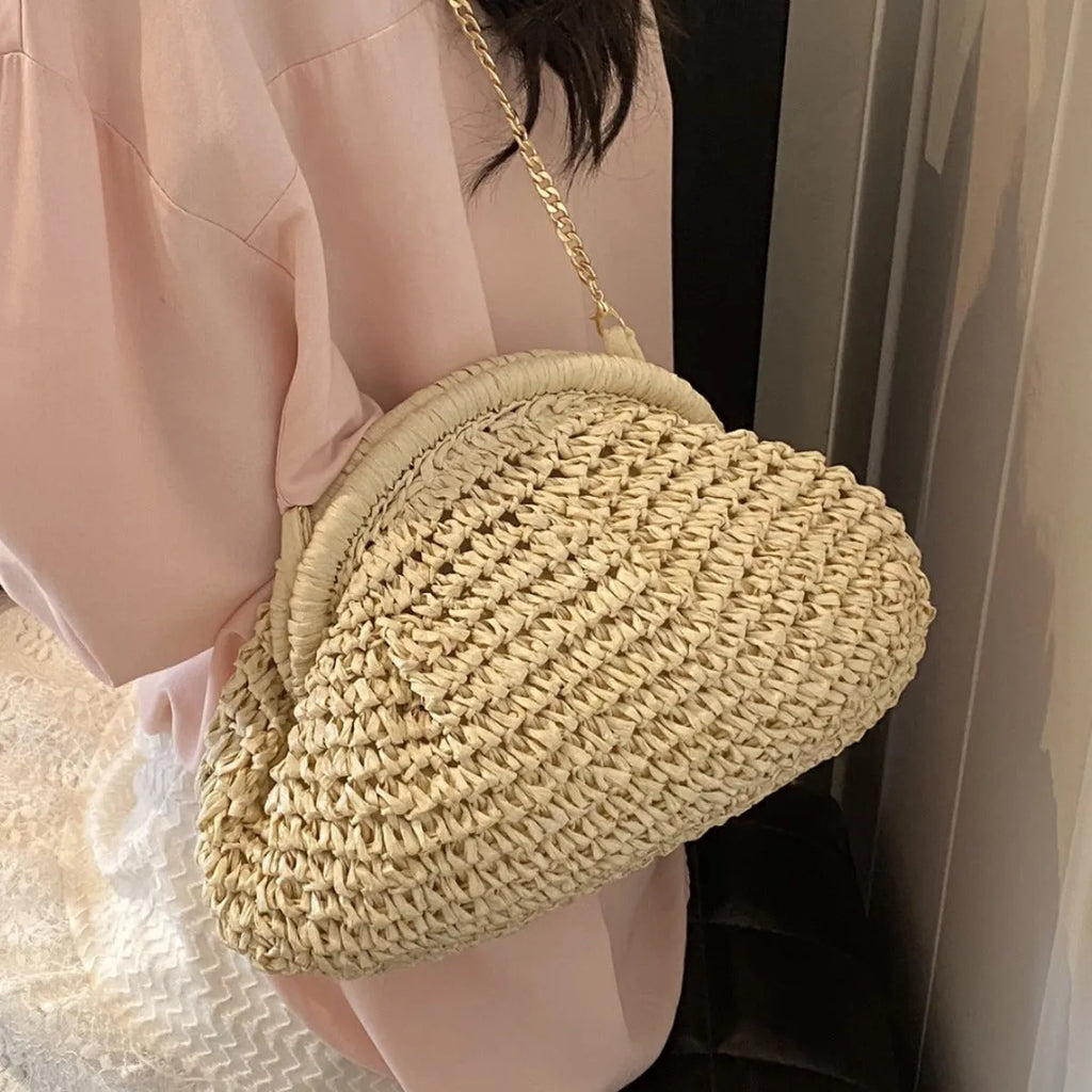 Women's straw beach shoulder bag in khaki colour with chain accent detail