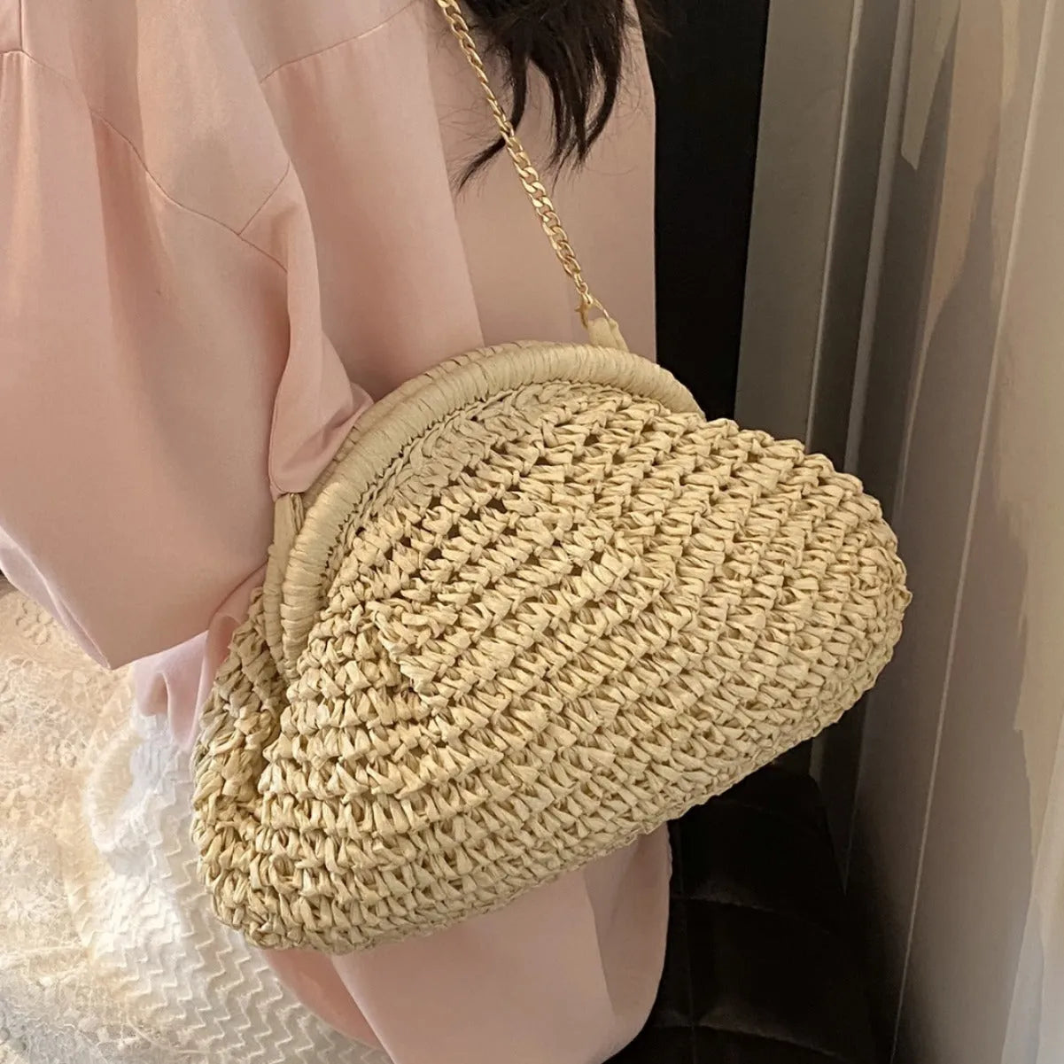 Women's straw beach shoulder bag in khaki colour with chain accent detail