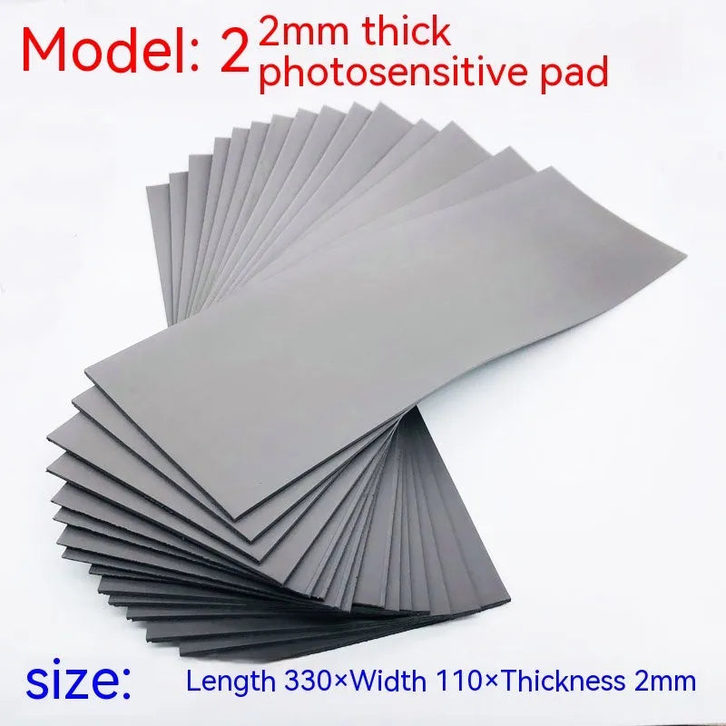 Black and grey plastic light-sensitive craft mat for seal making, showing 7mm, 4mm and 2mm thickness options.