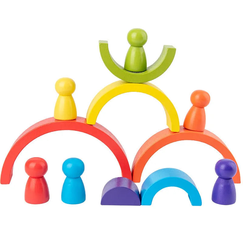 Rainbow arched wooden building blocks in a colourful stack on a flat surface