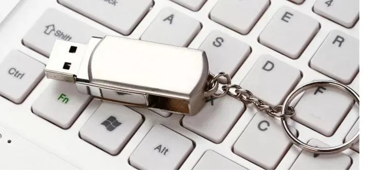 Metal rotating USB flash drive in black with USB 3.0 connector showing compact design