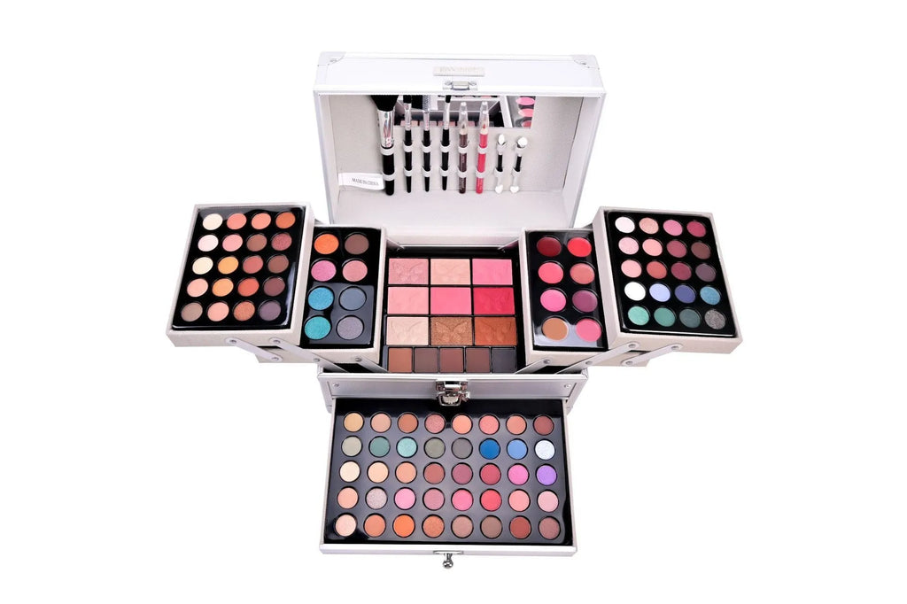 Silver makeup set with eye shadow, blush, lip gloss, lip pencil, and brush in a compact case