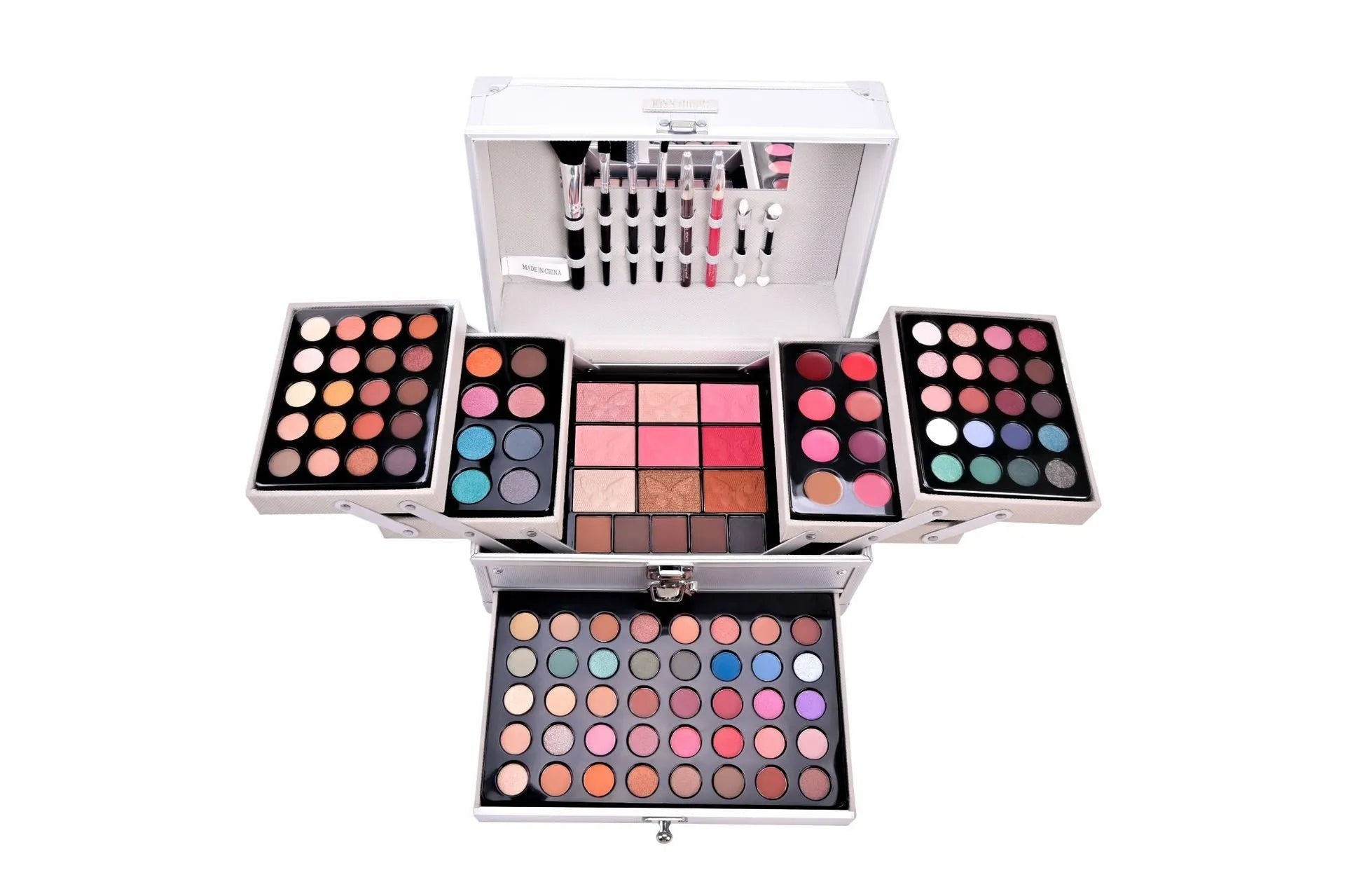 Silver makeup set with eye shadow, blush, lip gloss, lip pencil, and brush in a compact case