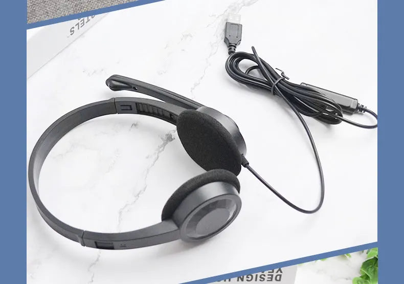 Black wired USB headset with sponge ear cushions and microphone for computer gaming and calls