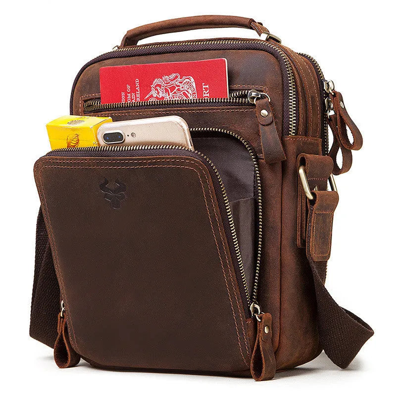 Men's brown genuine leather single-shoulder crossbody bag with visible stitching, shown on a model.