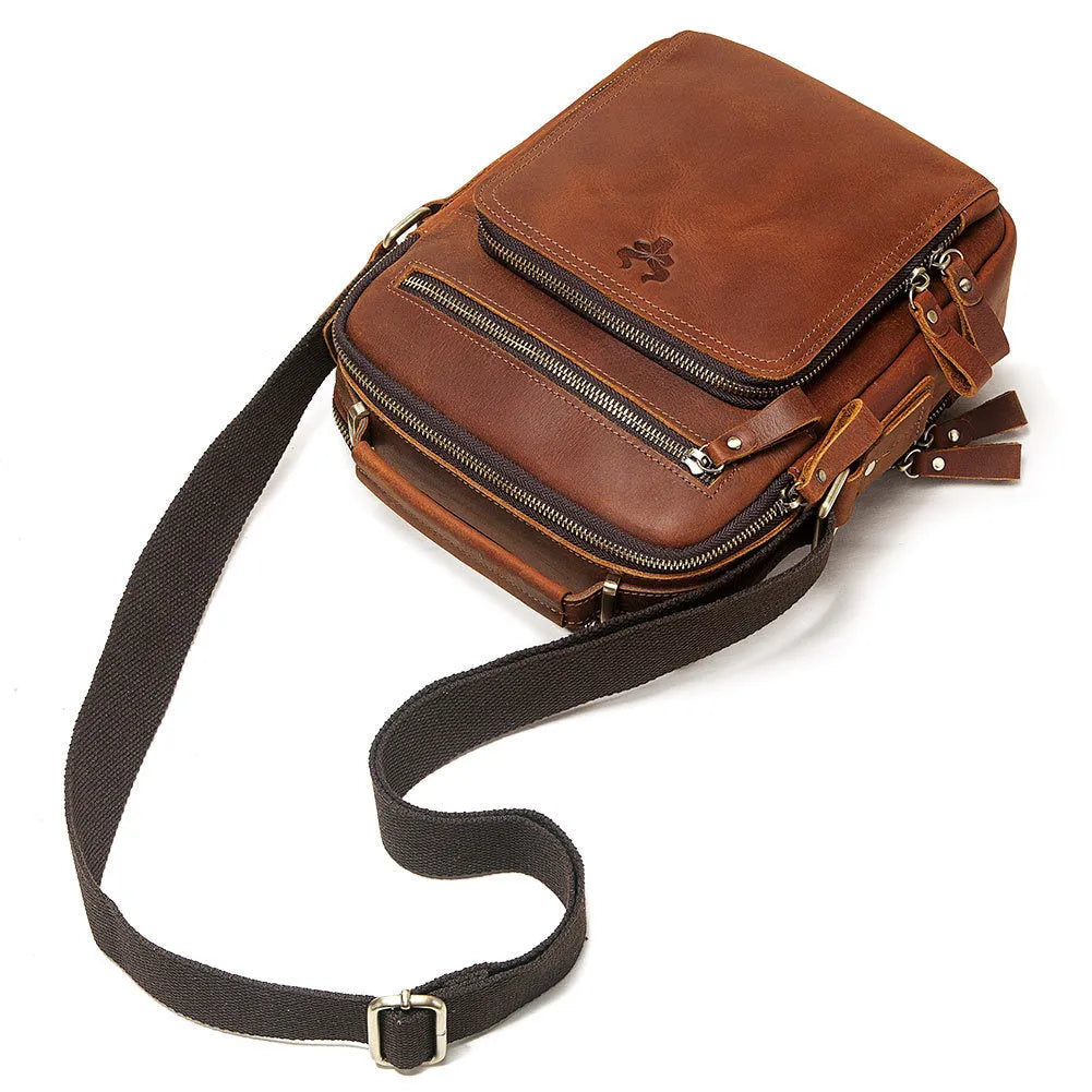 Men's brown genuine leather single-shoulder crossbody bag with visible stitching, shown on a model.